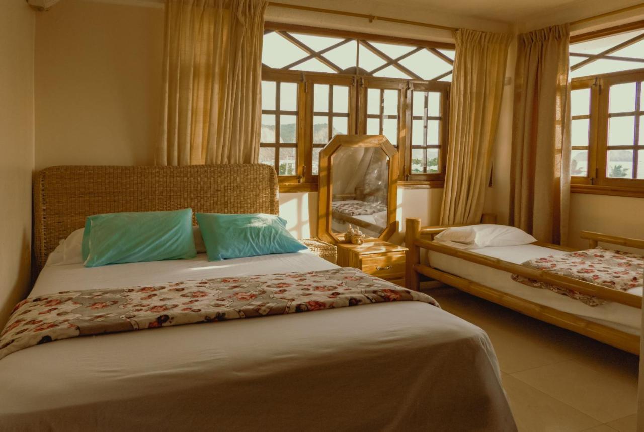 Hostal Poseidon Puerto Cayo Esterno foto