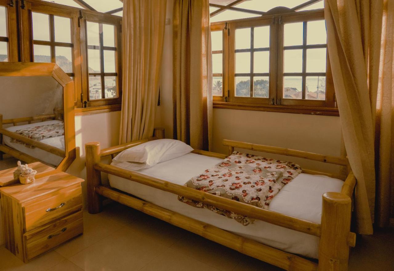 Hostal Poseidon Puerto Cayo Esterno foto