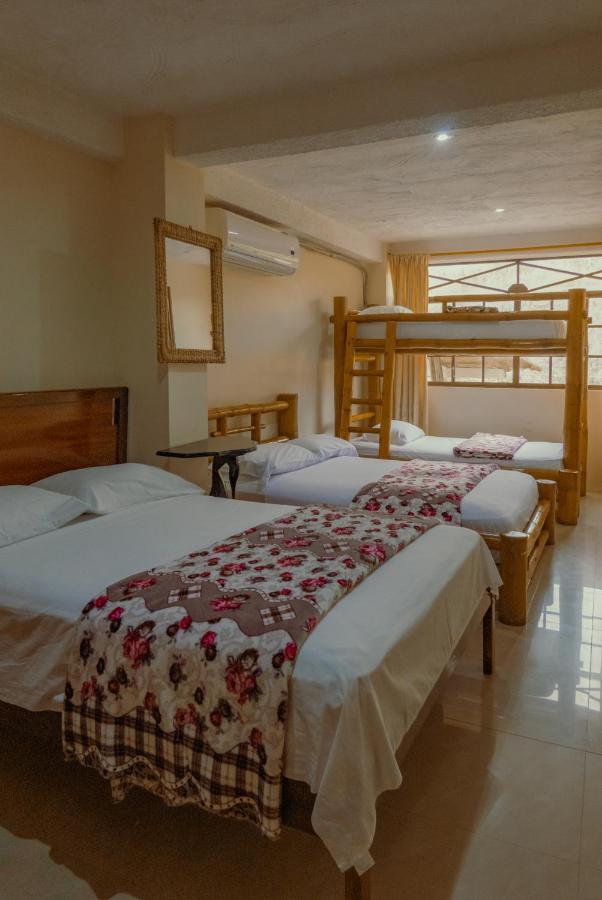 Hostal Poseidon Puerto Cayo Esterno foto