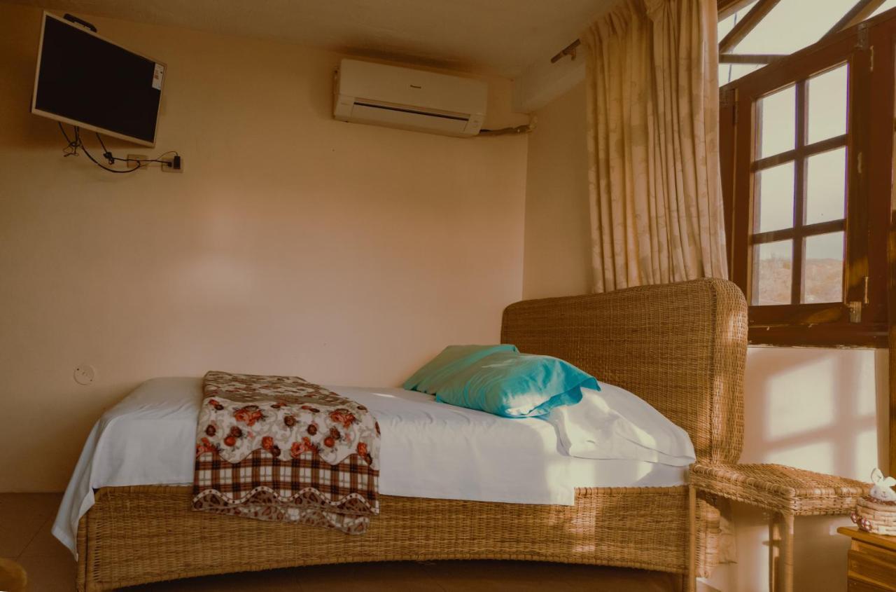 Hostal Poseidon Puerto Cayo Esterno foto