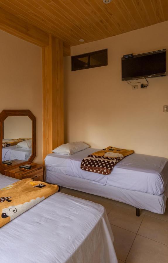 Hostal Poseidon Puerto Cayo Esterno foto