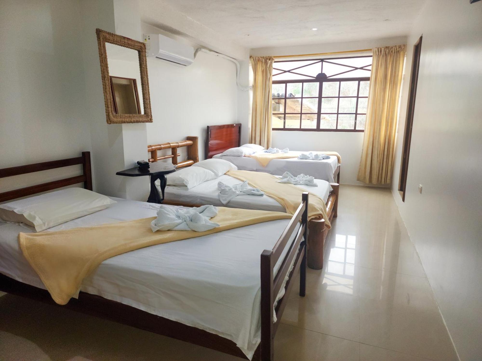Hostal Poseidon Puerto Cayo Esterno foto