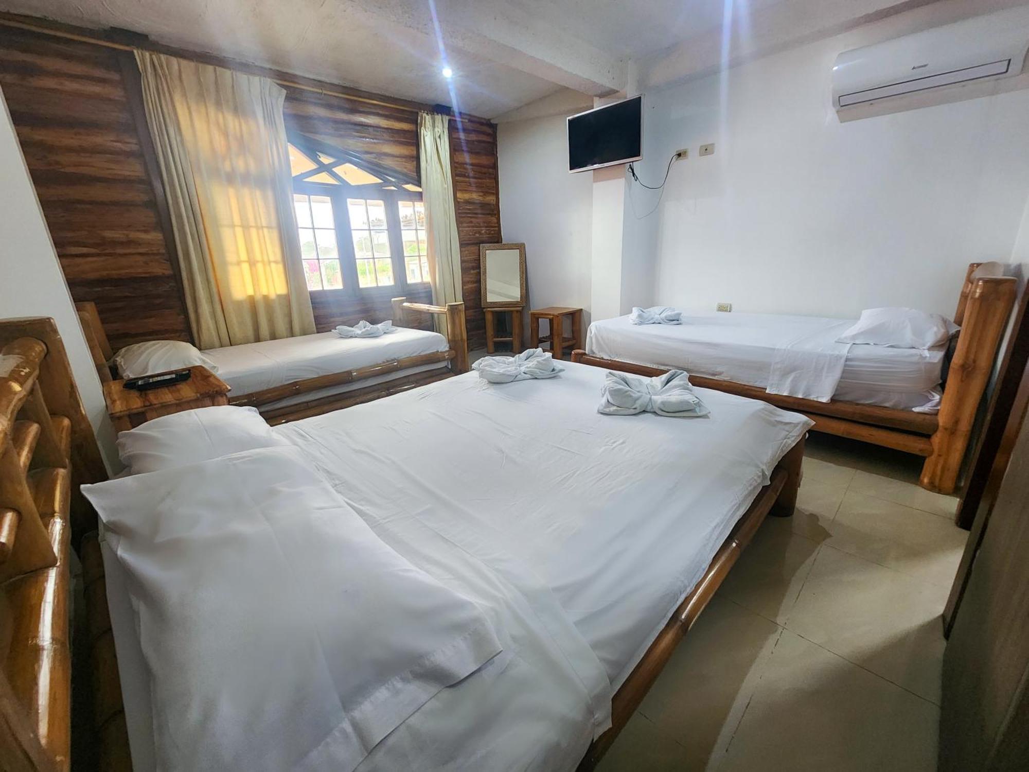 Hostal Poseidon Puerto Cayo Esterno foto